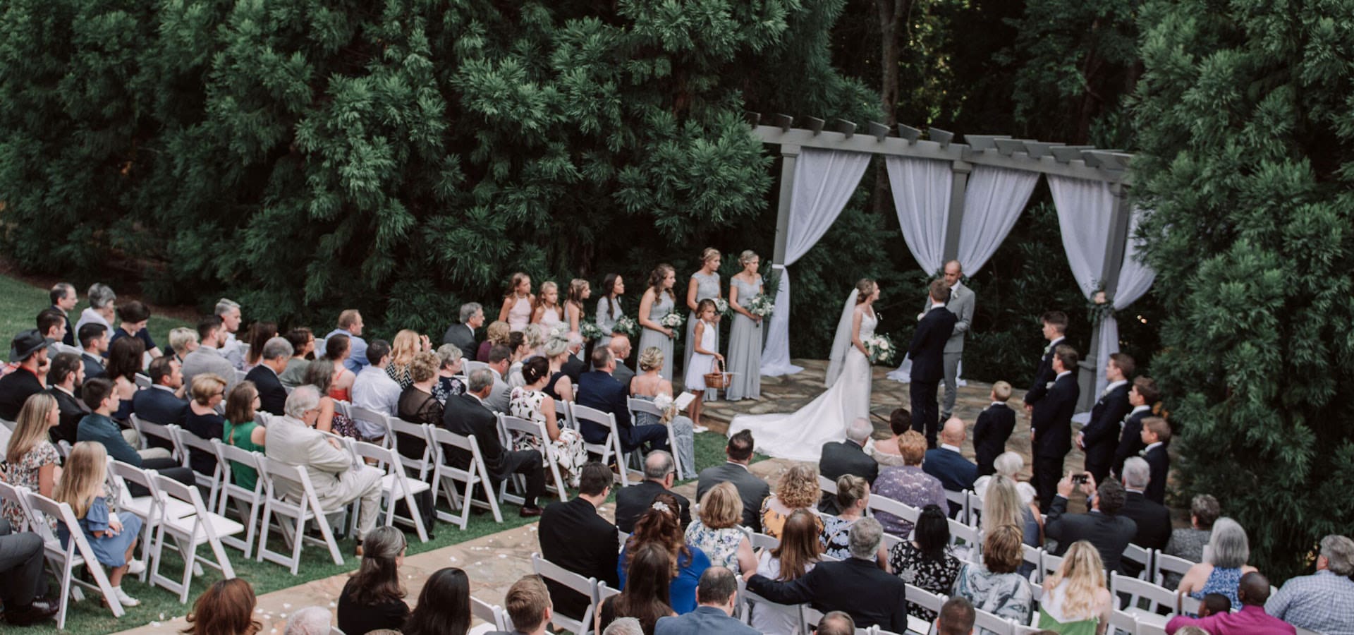 Outdoor wedding ceremony with guests