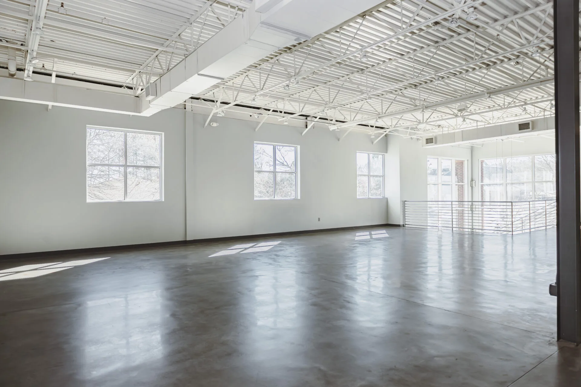 Open upstairs photography studio with high ceilings and natural light at Venue 92