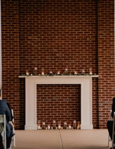 Patio mantle with curtains, candles, and decor