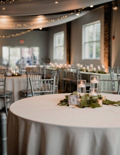 Elegant reception area tables with candles and decor